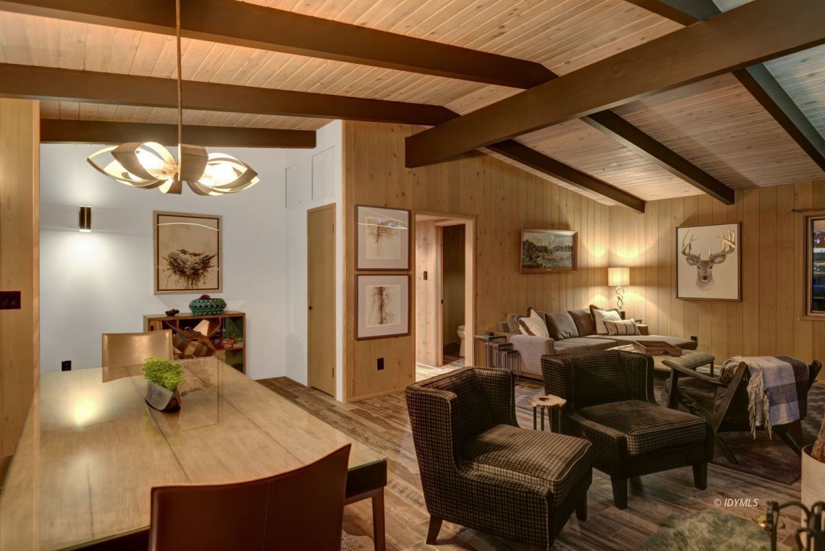 26780 Saunders Meadow Road Idyllwild, CA 92549 - Photo 19 of 41 a living room with furniture a chandelier and a dining table