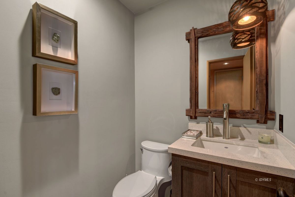 26780 Saunders Meadow Road Idyllwild, CA 92549 - Photo 32 of 41 a bathroom with a toilet a sink and mirror