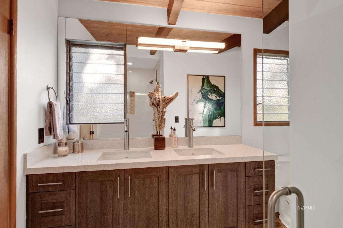 26780 Saunders Meadow Road Idyllwild, CA 92549 - Photo 36 of 41 a bathroom with a double vanity sink and a mirror