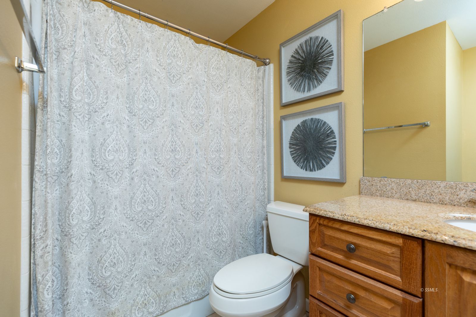 815 Hurschell Avenue Ridgecrest, CA 93555 - Photo 28 of 43 a bathroom with a granite countertop toilet and a sink