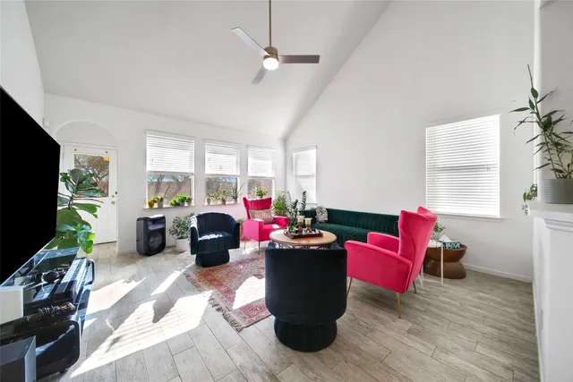 a living room filled with furniture and a flat screen tv