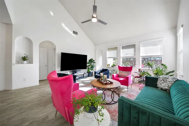 a living room with furniture fireplace and a flat screen tv