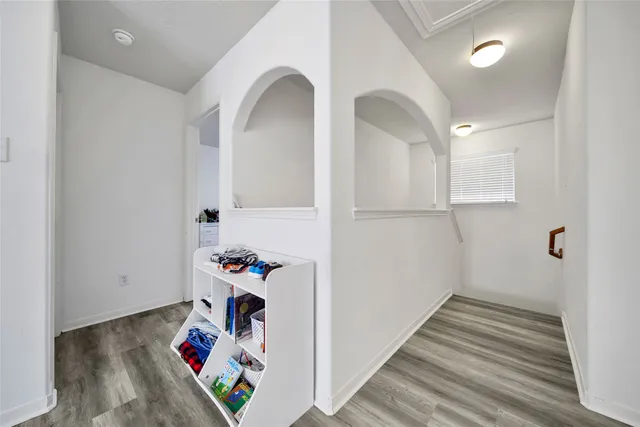 a bed room with furniture and window