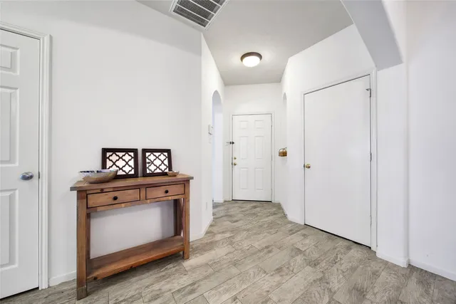 a view of a kitchen with a stove top oven