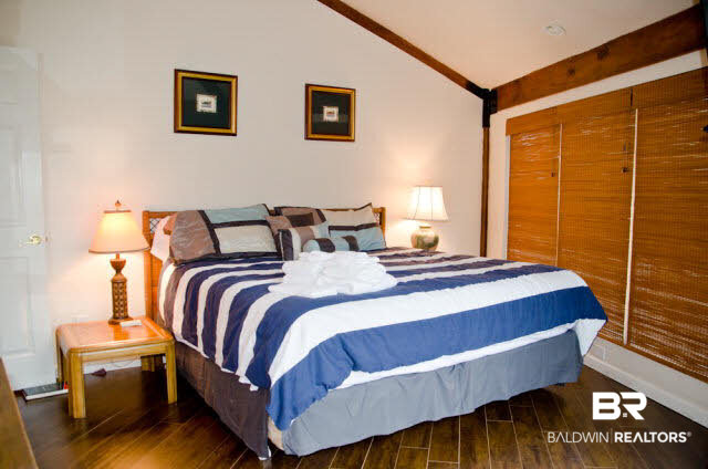 5751 Alabama Street Orange Beach, AL 36561 - Photo 19 of 25 Second Bedroom with Sliding Door to the upper deck where you will enjoy Bay views!