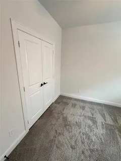 a view of room with window and ceiling fan