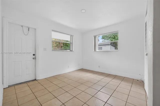 a view of an empty room and window