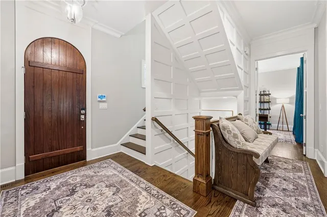 a living room with fireplace furniture and a large window
