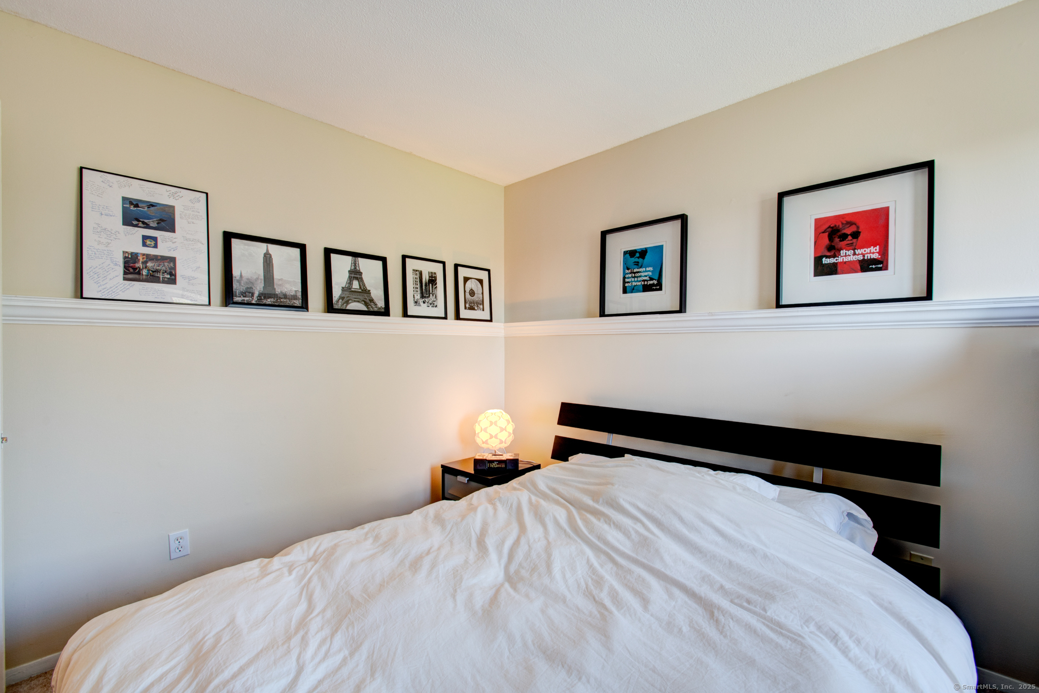 184 Gravel Street, Unit 26 Meriden, CT 06450 - Photo 15 of 27 a bedroom with a bed and a painting on the wall