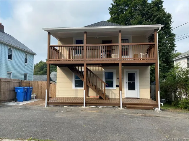 a front view of a house with garage