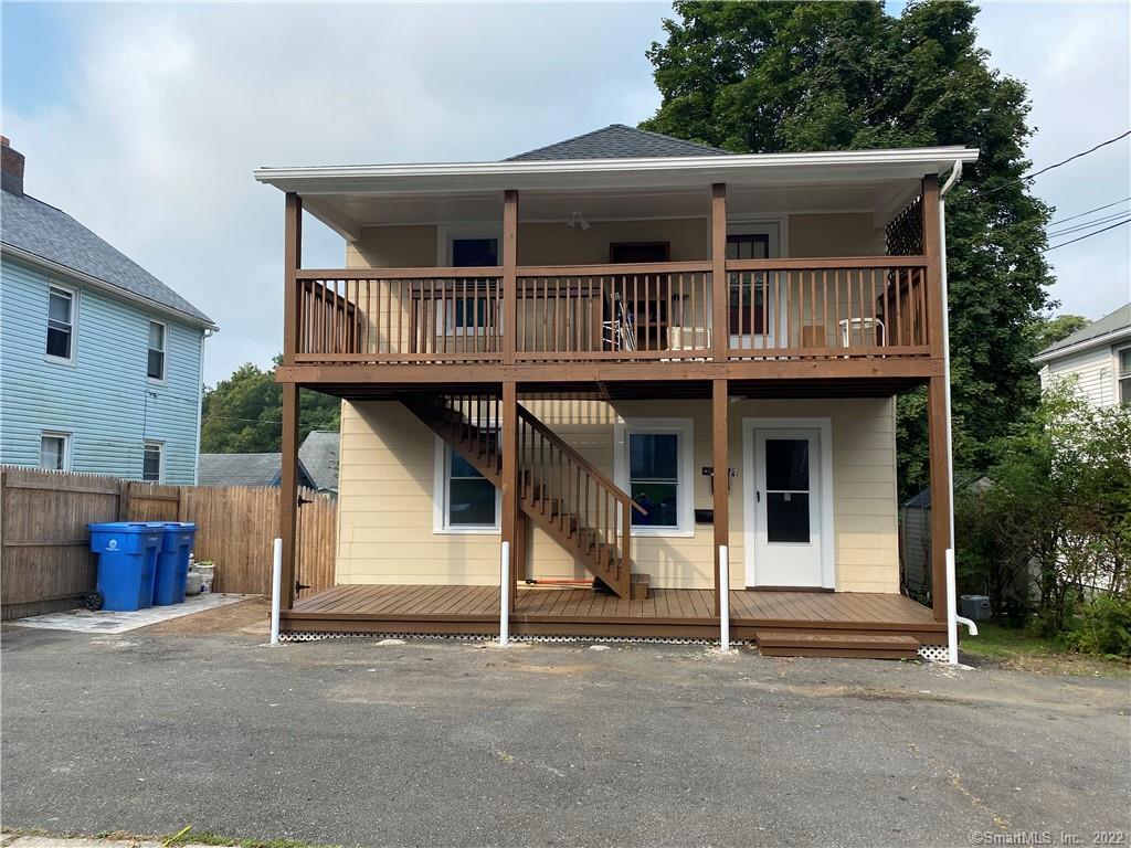 a front view of a house with garage