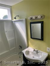 79 North Pond Street Bristol, CT 06010 - Photo 12 of 13 a bathroom with a sink and a mirror