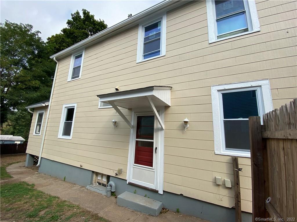 79 North Pond Street Bristol, CT 06010 - Photo 3 of 13 a view of a small house and a garage
