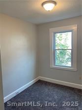 79 North Pond Street Bristol, CT 06010 - Photo 9 of 13 an empty room with a window