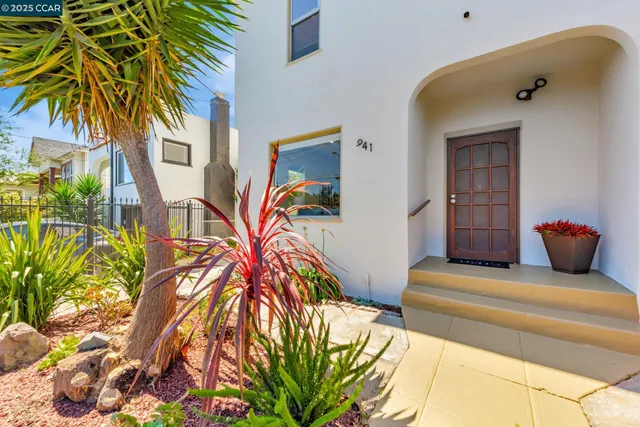 a bedroom with a bed and a potted plant