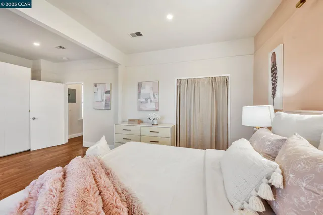 a bedroom with a bed and a dresser