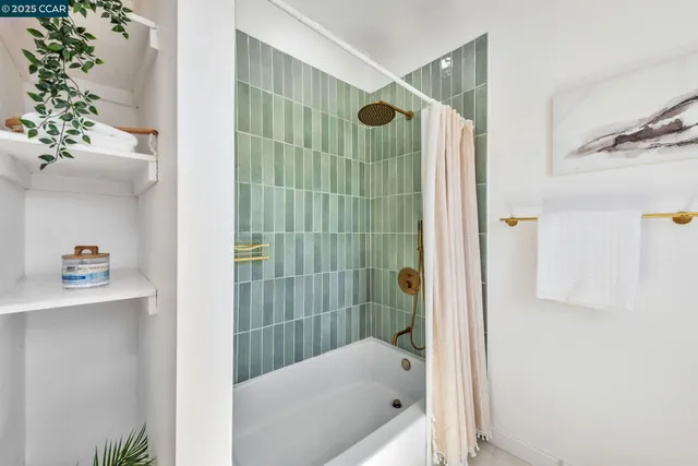 a bathroom with a shower and a tub