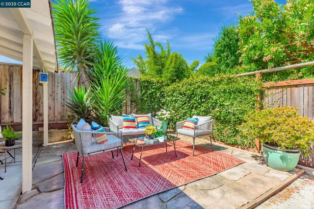 a backyard of a house with seating space