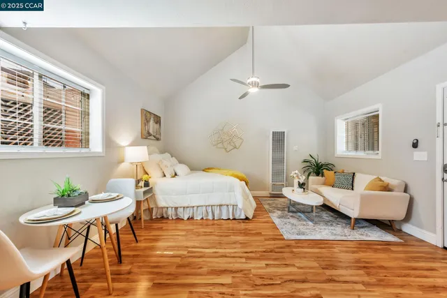 a spacious bedroom with a bed and window