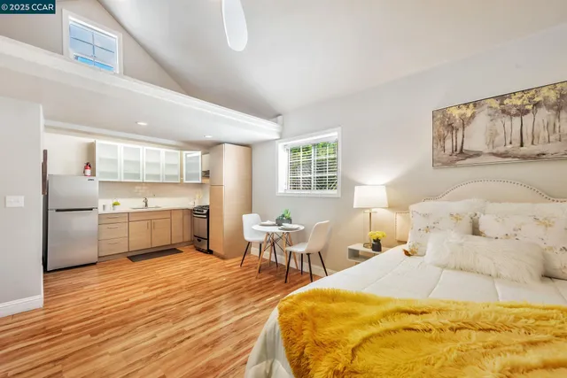 a kitchen with stainless steel appliances a refrigerator sink and cabinets