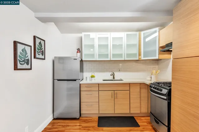 a spacious bedroom with a bed and a table chair