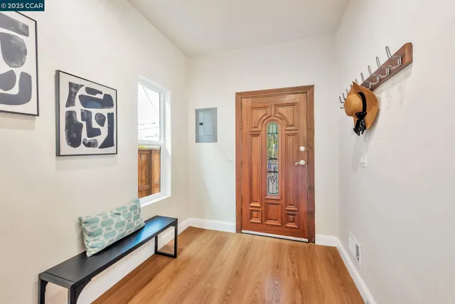 a view of a room with window and wooden floor