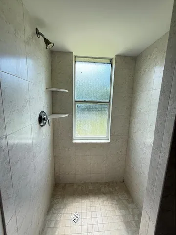 an empty room with a bathroom