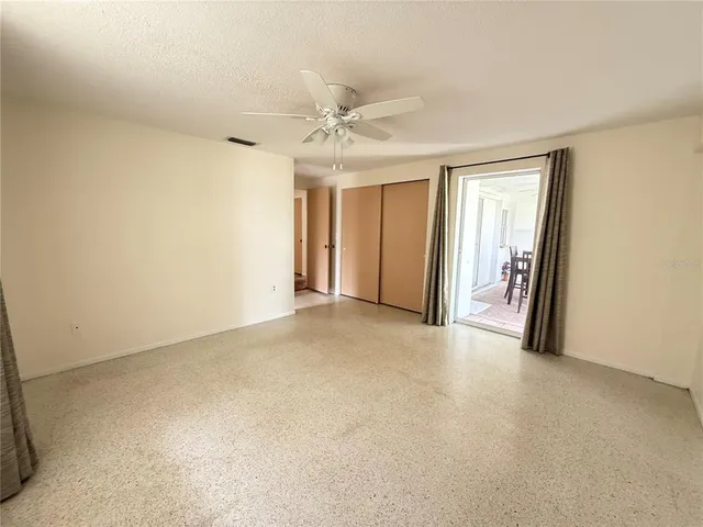 a kitchen with kitchen island granite countertop a sink and a stove next to a window