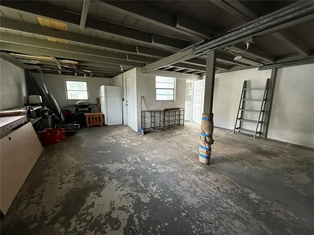 a view of backyard with seating and green space