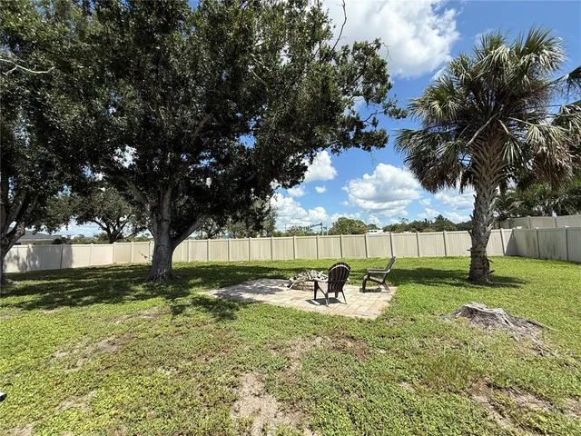 a view of backyard with tree