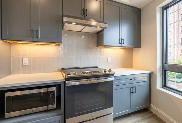 a kitchen with a stove and a sink