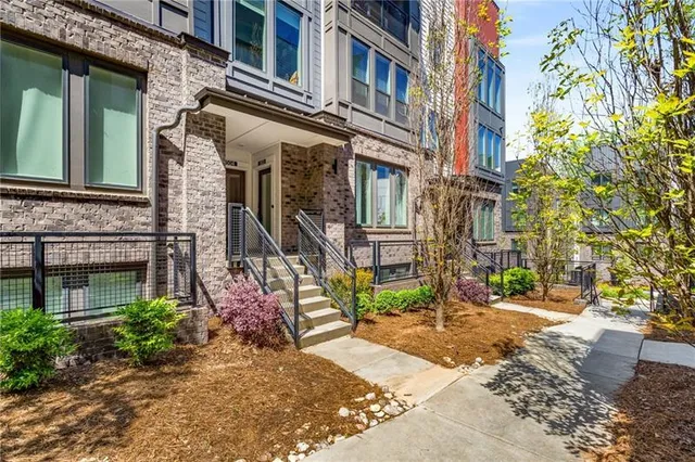 a view of a brick building with many windows