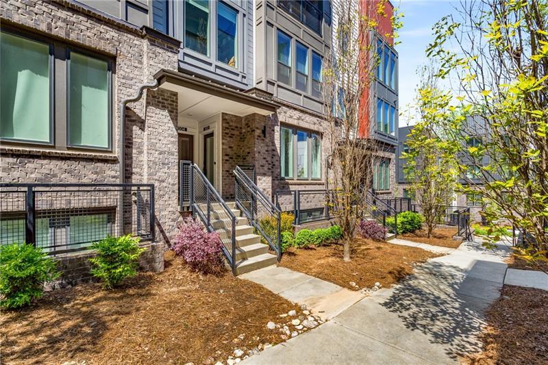 a view of a brick building with many windows
