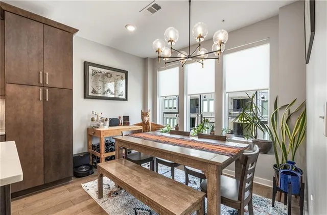 a view of a dining room with furniture window and wooden floor