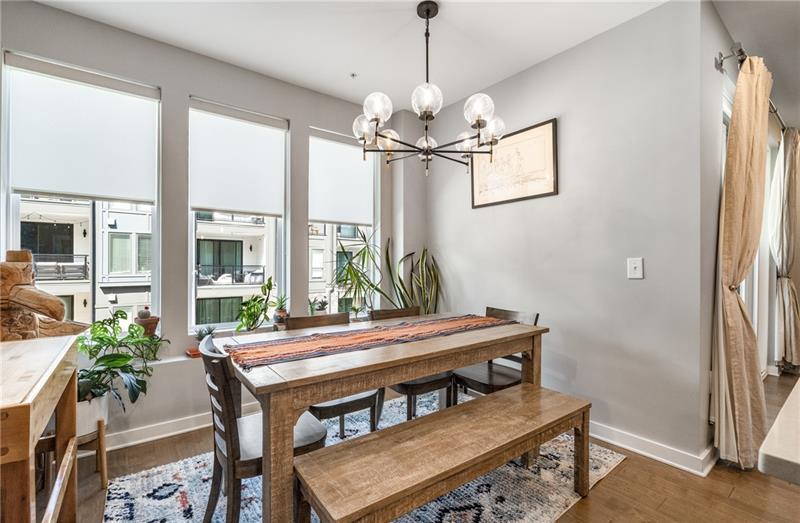 383 Pratt Drive, Unit 504 Atlanta, GA 30315 - Photo 19 of 48 a view of a dining room with furniture window and wooden floor
