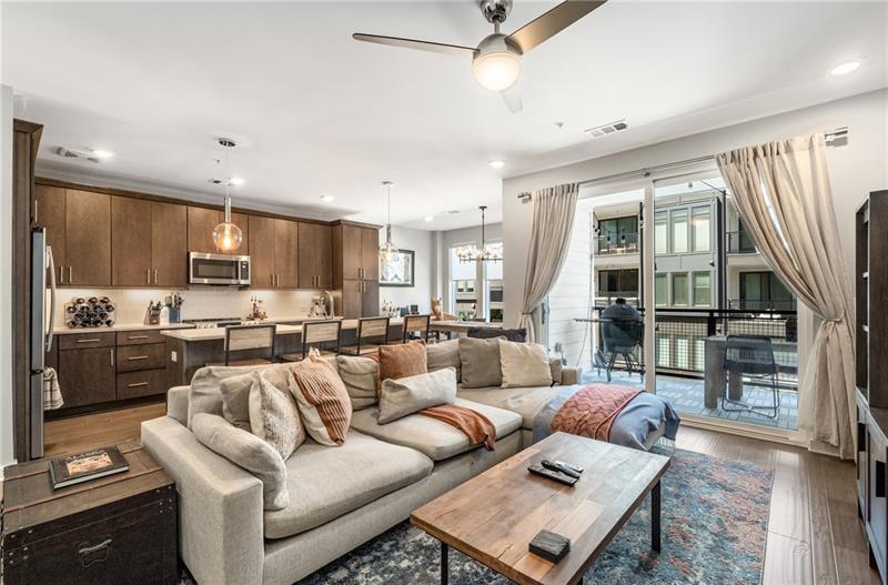 383 Pratt Drive, Unit 504 Atlanta, GA 30315 - Photo 20 of 48 a living room with furniture kitchen view and a window