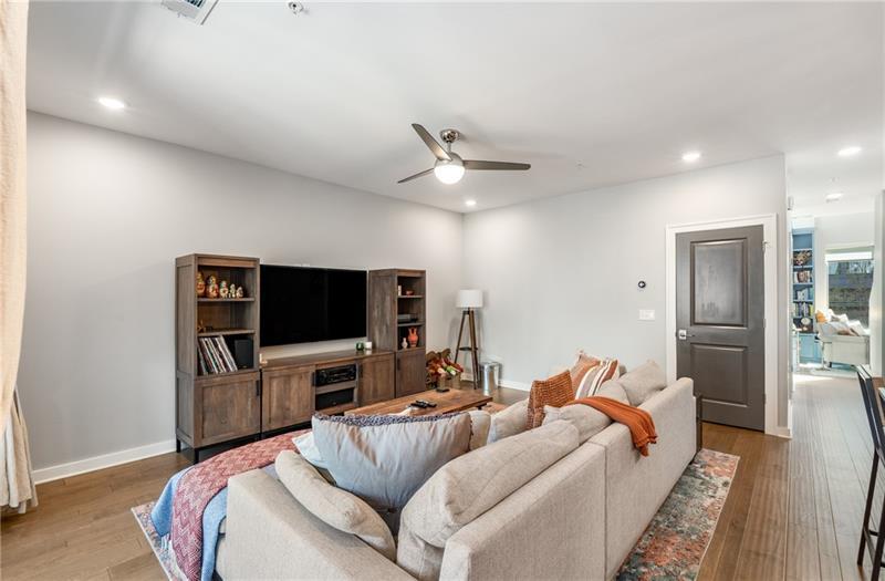 383 Pratt Drive, Unit 504 Atlanta, GA 30315 - Photo 22 of 48 a living room with furniture and a flat screen tv