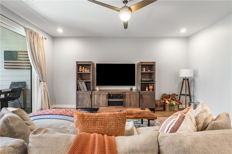 383 Pratt Drive, Unit 504 Atlanta, GA 30315 - Photo 23 of 48 a living room with furniture and a flat screen tv
