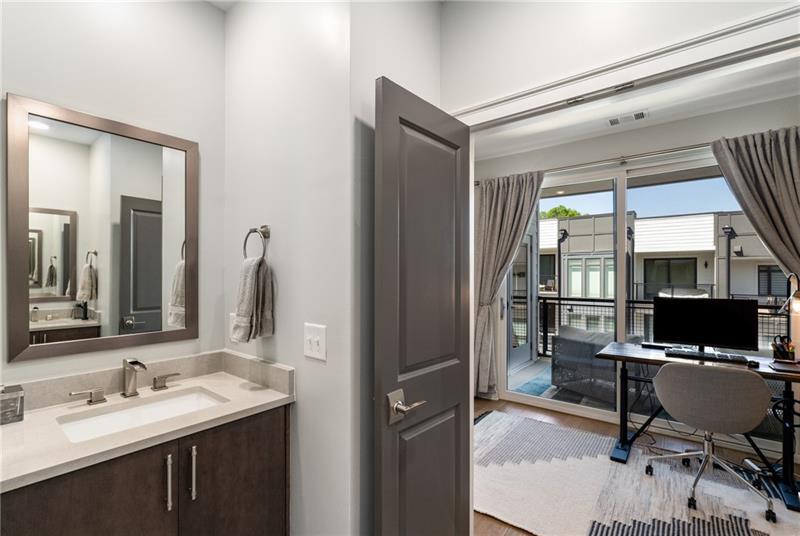 383 Pratt Drive, Unit 504 Atlanta, GA 30315 - Photo 26 of 48 a en suite bathroom with a sink mirror and a shower