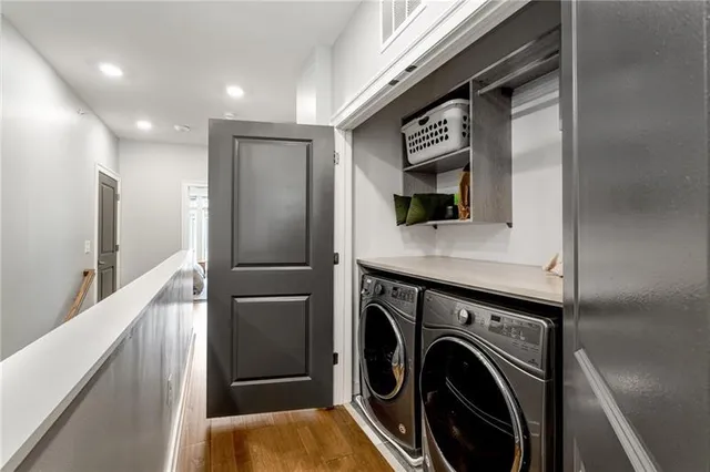 a view of a hallway with washer and dryer