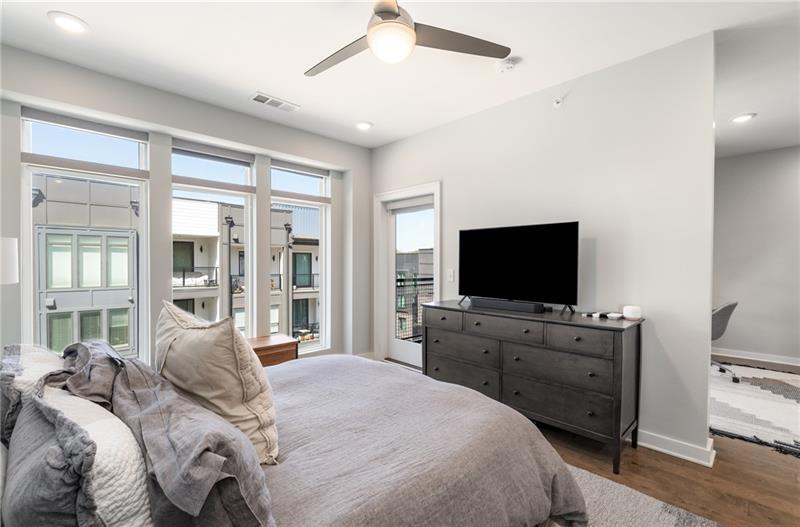 383 Pratt Drive, Unit 504 Atlanta, GA 30315 - Photo 31 of 48 a bedroom with a bed and a flat screen tv on the dresser