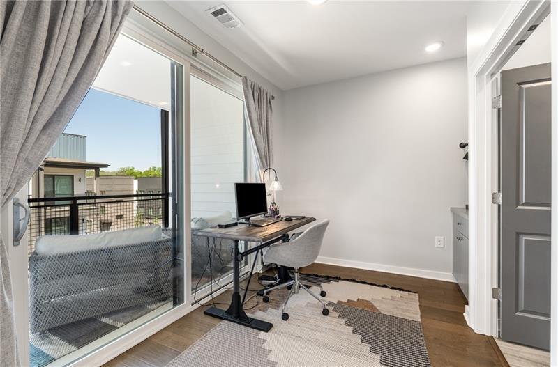 383 Pratt Drive, Unit 504 Atlanta, GA 30315 - Photo 33 of 48 a view of a workspace with furniture and a window