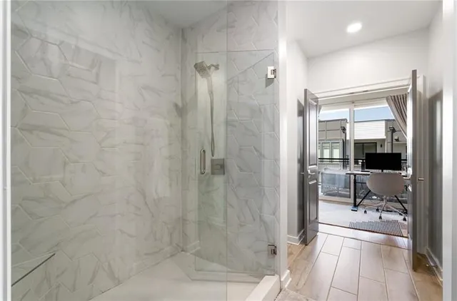 a bathroom with a shower and a sink