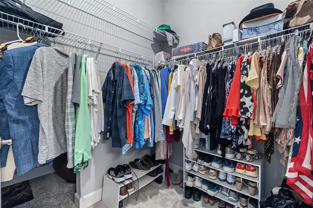 a bathroom with a toilet a sink and shower
