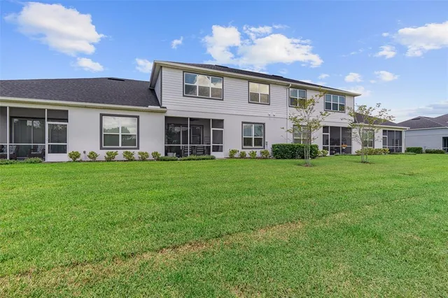an aerial view of a house with a lake view
