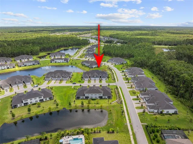 a kitchen with a sink and wooden floor