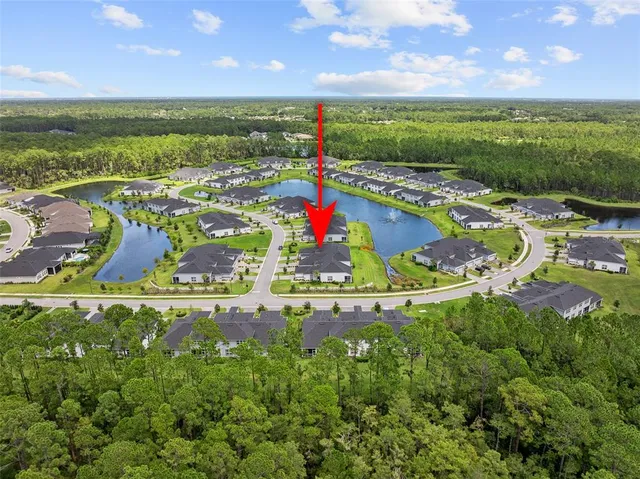 a living room with lots of furniture and a large window