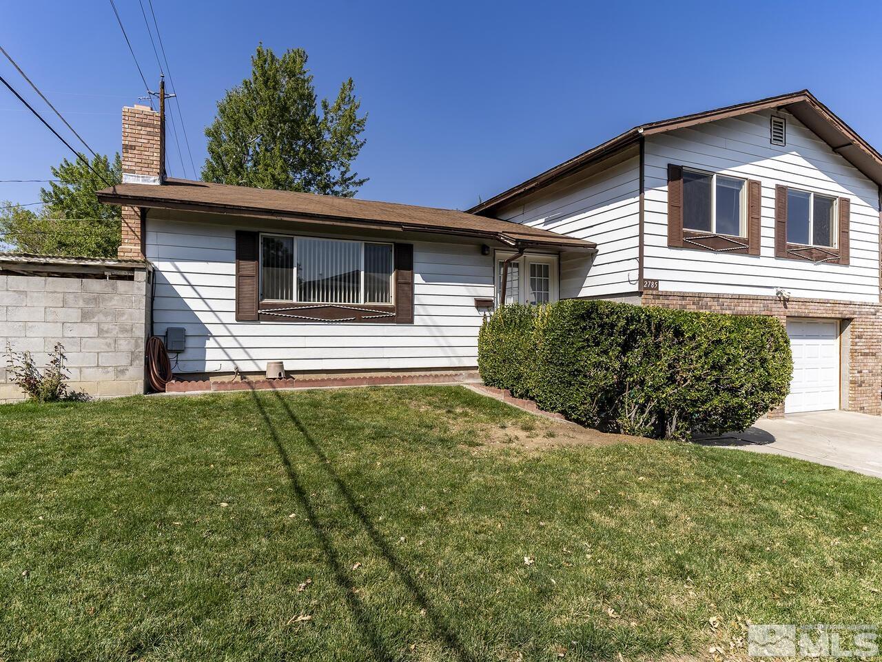2785 Edgewood Drive Reno, NV 89503 - Photo 2 of 26 a front view of a house with garden