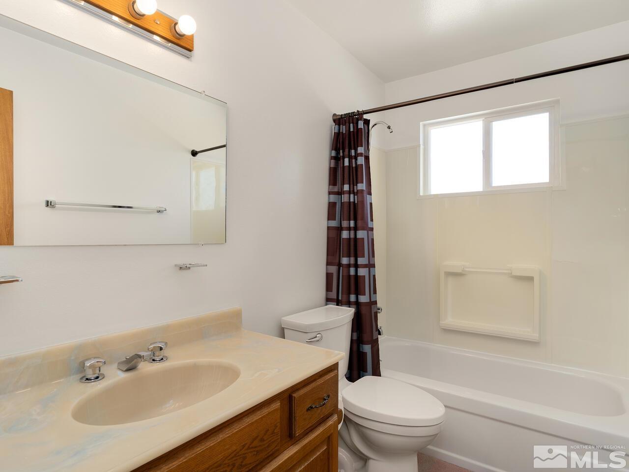 2785 Edgewood Drive Reno, NV 89503 - Photo 21 of 26 a bathroom with a sink toilet and shower