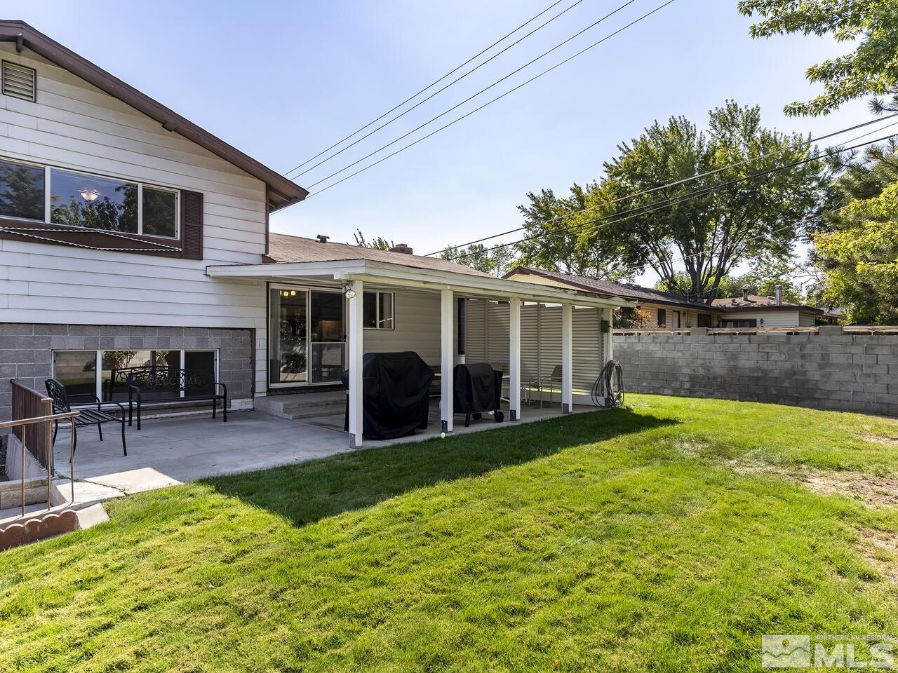 2785 Edgewood Drive Reno, NV 89503 - Photo 23 of 26 a view of a house with a patio and a yard
